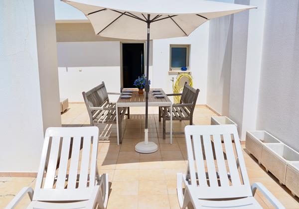 Blue Sky Private Terrace With Sun Loungers And Dining Area