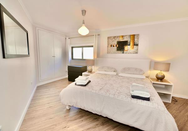 King Bedroom 1 Palm Tree Apartment SMP Holiday Rentals