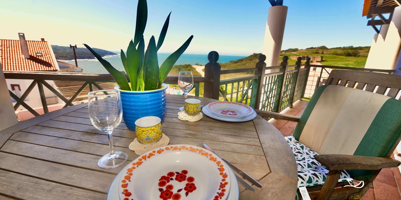 Outdoor Dining Area With View Over The Sea And Pool In Holiday Apartment In Gilmafacho Sao Martinho Do Porto Portugal