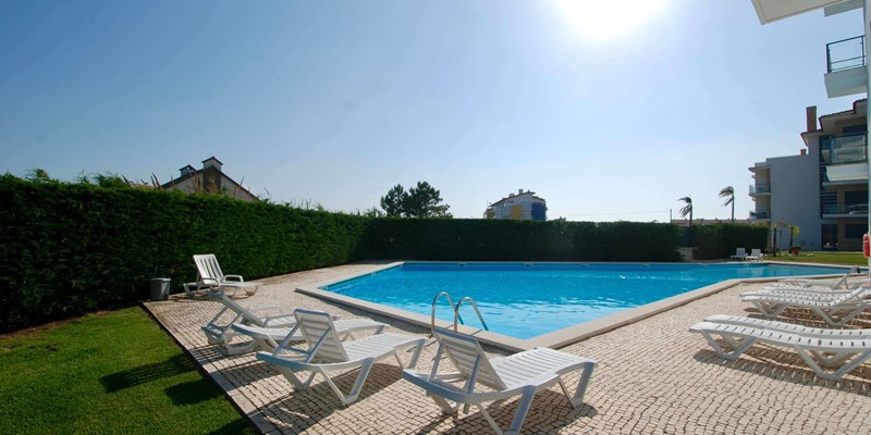 Pool area with sun loungers for guests