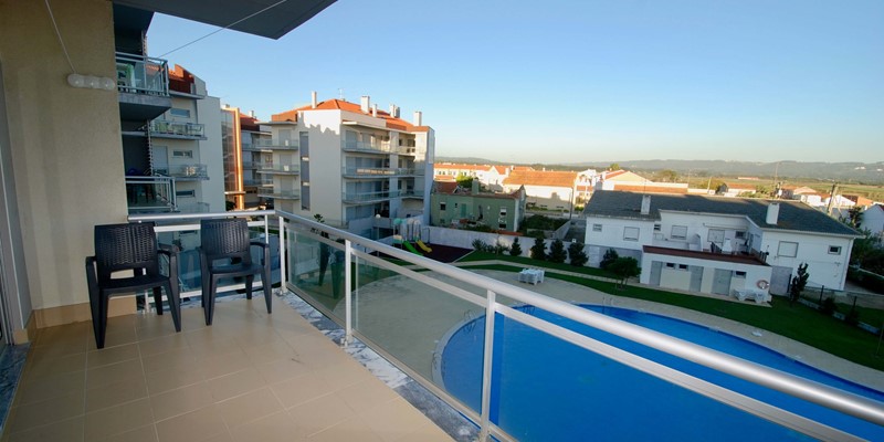 Balcony with view over the pool