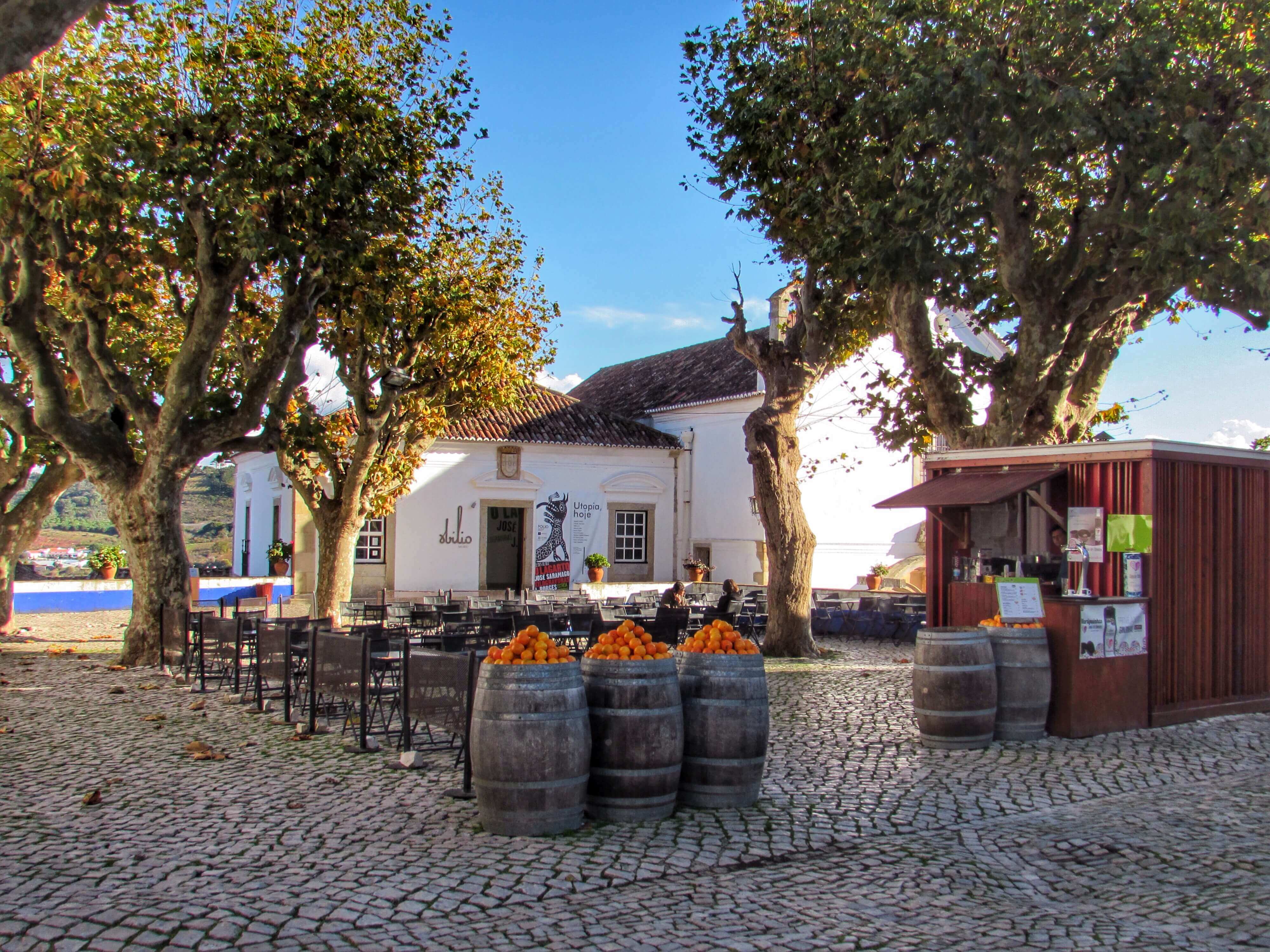 Bars Line The Central Praca Or Square In Obidos