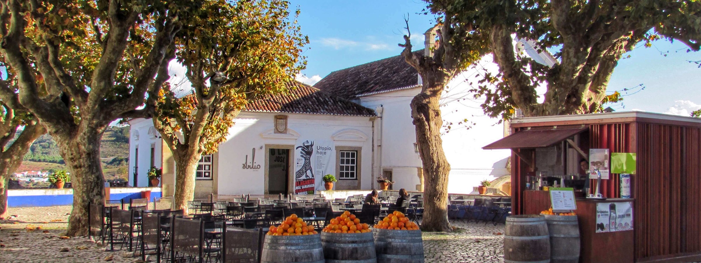 Bars Line The Central Praca Or Square In Obidos