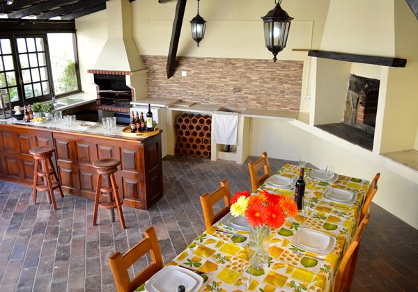 Large kitchen with barbeque and dining area