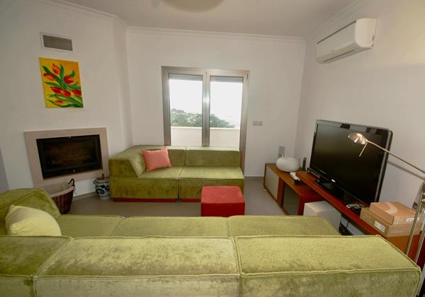 Lounge Area With Fireplace In Holiday Home