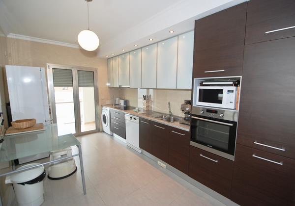 Well Equipped Kitchen With Access To Balcony